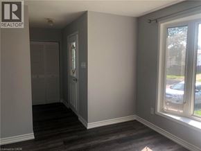 Hamilton apartment for rent - A room with a window and a door.