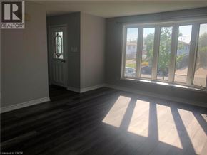 Hamilton apartment for rent - A room with a door and a window with sunlight coming through.