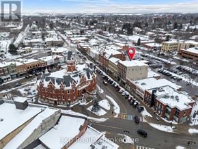 Stratford multi-family for rent - A red building with a tower is in the middle of a town square.
