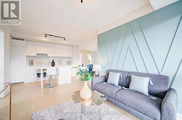 Toronto (Bay Street Corridor) condo for rent - A living room with a grey couch and a coffee table.