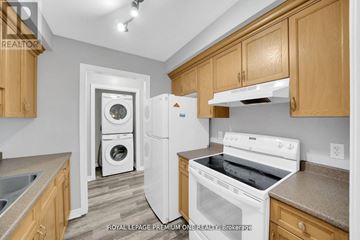 Shelburne apartment for rent - A kitchen with wooden cabinets and a white dishwasher.