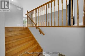 Shelburne apartment for rent - A wooden staircase with a railing in a house.