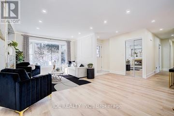 Toronto (Banbury-Don Mills) apartment for rent - A modern living room with a dark blue sofa and a wooden floor.