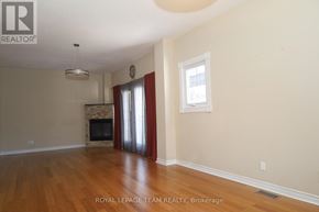 Ottawa apartment for rent - A living room with a fireplace and a window.