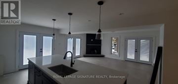 Toronto (Highland Creek) apartment for rent - A modern kitchen with a sink and a large island.