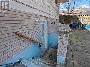 Welland (N. Welland) duplex for rent - A blue door is on a brick wall.
