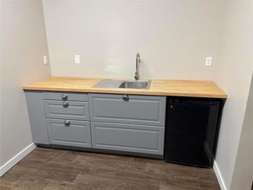 Carman apartment for rent - A kitchen with a sink and a trash can.