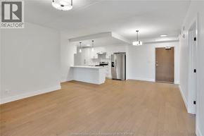 Lasalle condo for rent - A spacious, empty room with wooden flooring and white walls.