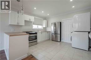 Hamilton apartment for rent - A kitchen with white cabinets and appliances.