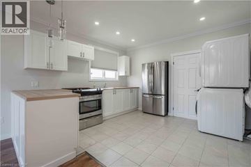 Hamilton apartment for rent - A kitchen with white cabinets and appliances.