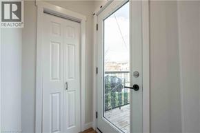 Hamilton apartment for rent - A white door with a glass window is open.
