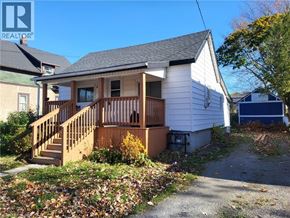 Port Colborne apartment for rent - A small house with a deck and stairs leading to the front door.