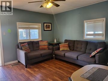 Port Colborne apartment for rent - A living room with two grey couches and a ceiling fan.