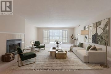 Toronto (Moss Park) condo for rent - A living room with a fireplace and a large painting on the wall.