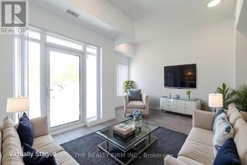 London East (East K) condo for rent - A living room with a glass table and a white couch.