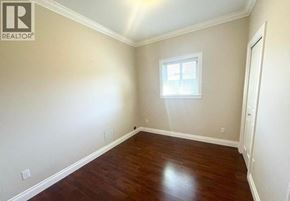 Richmond apartment for rent - A room with a window and wooden flooring.