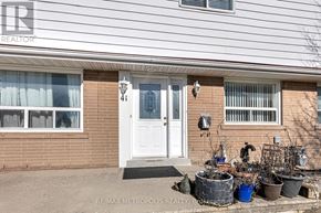 Richmond Hill (Crosby) apartment for rent - A house with a white door and windows with plants in front.