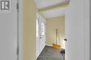 Richmond Hill (Crosby) apartment for rent - A room with a door, a window, and a shovel on the floor.