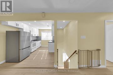 Richmond Hill (Crosby) apartment for rent - A kitchen with a refrigerator, oven, and sink is shown in a real estate listing.