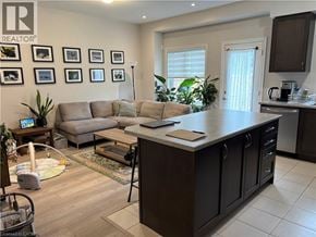 Brantford townhouse for rent - A living room with a grey couch and a coffee table.