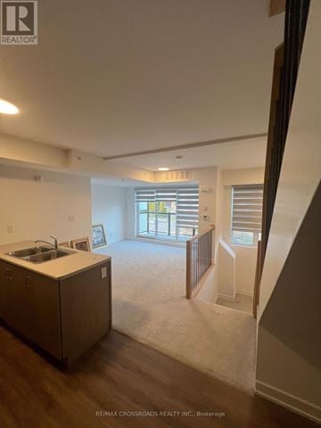 Whitby (Downtown Whitby) townhouse for rent - A kitchen with a sink and a window.