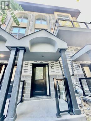 Whitby (Downtown Whitby) townhouse for rent - A house with a black front door and steps leading up to it.