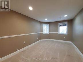 Newmarket (Stonehaven-Wyndham) apartment for rent - A large empty room with a window and a skylight.