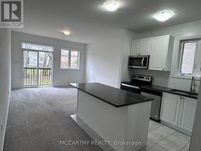 Southgate apartment for rent - A kitchen with a black countertop and white cabinets.