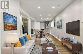Welland (Lincoln/Crowland) apartment for rent - A living room with a white couch and a painting on the wall.