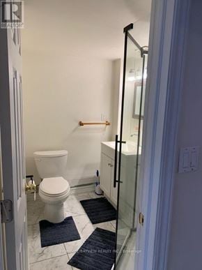 Richmond Hill (Harding) apartment for rent - A white toilet in a bathroom with a glass shower door.