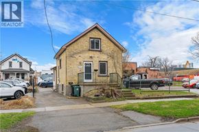 Kitchener apartment for rent - A house with a REALTOR® sign in front of it.