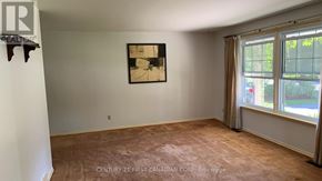 London North (North H) apartment for rent - A room with a painting on the wall and a window with curtains.