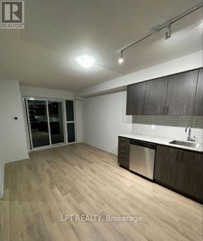 Toronto (Woburn) condo for rent - A kitchen with wooden floors and a sink.