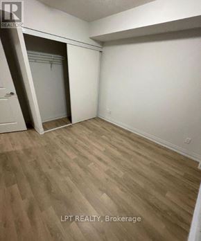 Toronto (Woburn) condo for rent - A room with a white door and a white wall.