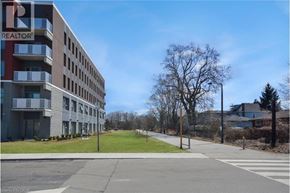 Hamilton condo for rent - A large building with the word REALTOR on the side of it.
