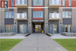Hamilton condo for rent - A building with the sign "SEVENTY SEVEN" on the front.