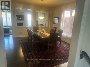 Hamilton (Waterdown) apartment for rent - A dining room with a table and chairs.