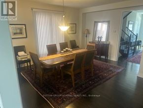Hamilton (Waterdown) apartment for rent - A dining room with a wooden table and chairs.