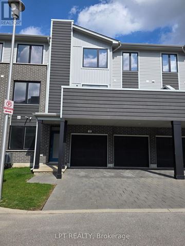 London East (East D) townhouse for rent - A modern two-story house with a garage is for sale.