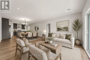 Russell apartment for rent - A well-lit, modern living room with a dining area in the background.