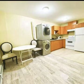 Surrey apartment for rent - A kitchen with a white refrigerator, a white table and chairs, and a white washing machine.