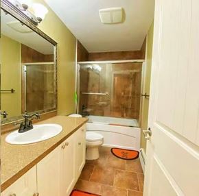 Surrey apartment for rent - A bathroom with a sink, toilet, and shower.