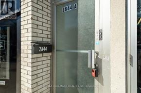 Toronto (East End-Danforth) apartment for rent - A glass door with a lock and a sign that says 2844 A.
