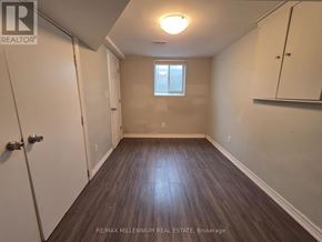 Toronto (L'amoreaux) apartment for rent - A room with wooden flooring and a window with blinds.