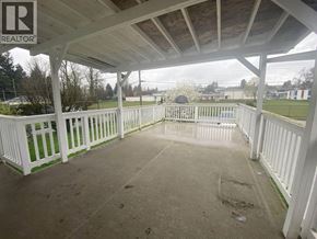 Burnaby apartment for rent - A white gazebo with a wooden roof and a sign that says REALTOR.