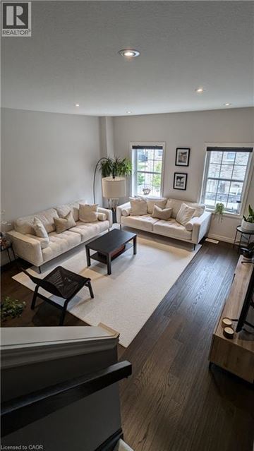 Kitchener townhouse for rent - A living room with a white couch and a coffee table.