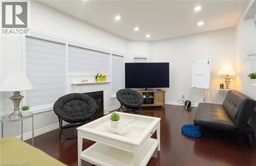 Waterloo apartment for rent - A living room with a black chair and a white coffee table.