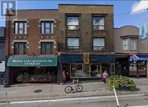 Toronto (Yonge-St. Clair) fourplex for rent - A street view of a building with a sign that says Braem and Minnett Inc. Antiques.