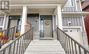 Blue Mountains apartment for rent - A house entrance with a grey door and a wreath on it.