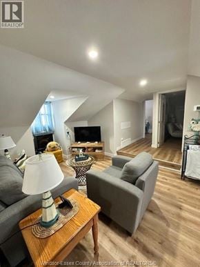 Belle River apartment for rent - A living room with a grey couch and a wooden coffee table.